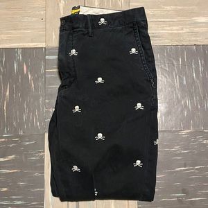 Black Chino (a little faded) Rugby pants with white skulls.